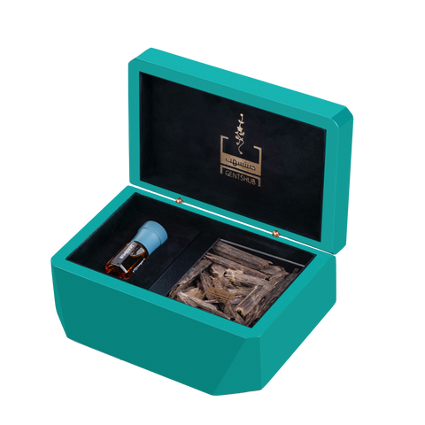 Luxury Teal Gift Box Open Displaying Oud Wood and Dahn Al Oud Bottle