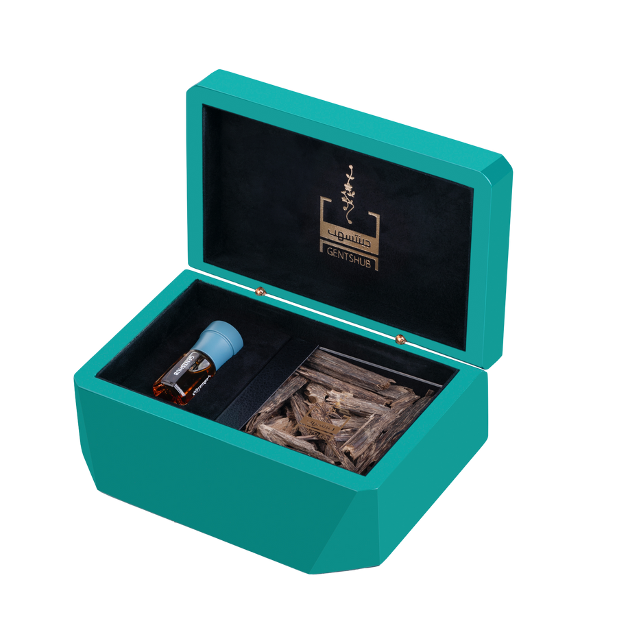 Luxury Teal Gift Box Open Displaying Oud Wood and Dahn Al Oud Bottle
